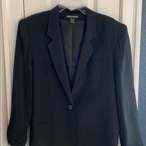 Savannah 100% silk blazer with polyester lining.